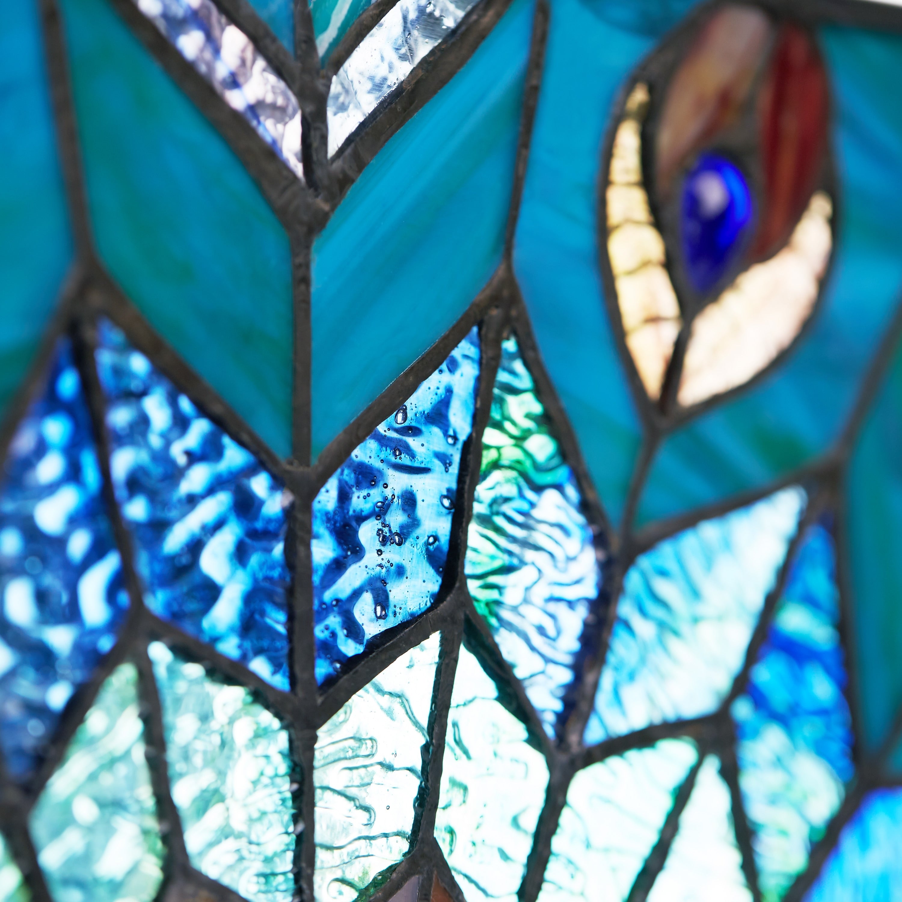 River of Goods 24-inch Tiffany-style Stained Glass Peacock Star Window Panel - 24L x 0.25W x 24H