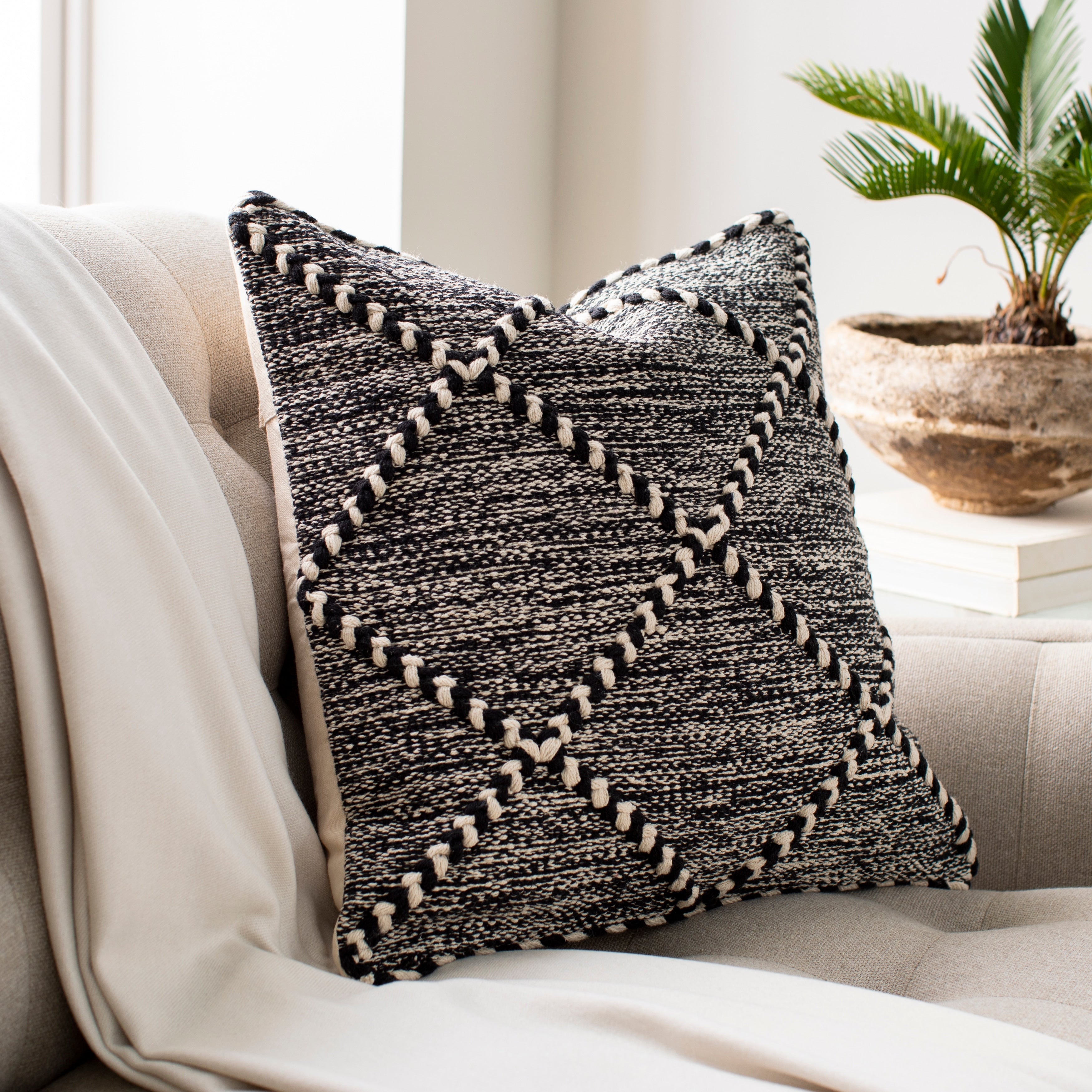 The Curated Nomad Pyrola Handwoven Black and White Boho Throw Pillow